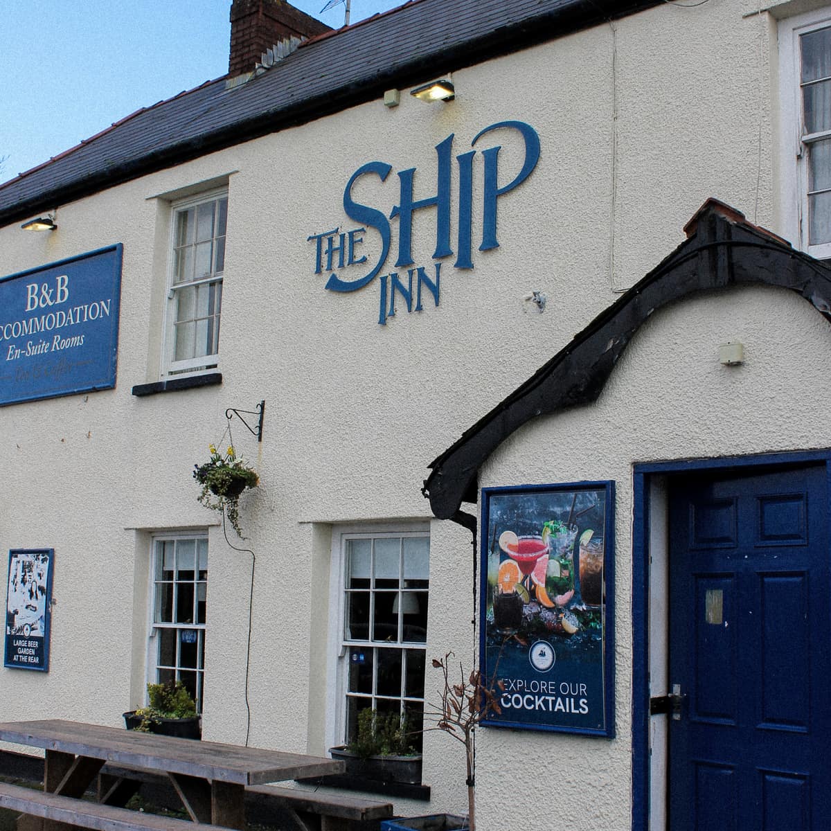 The front of The Ship Inn with its blue lettering and blue door